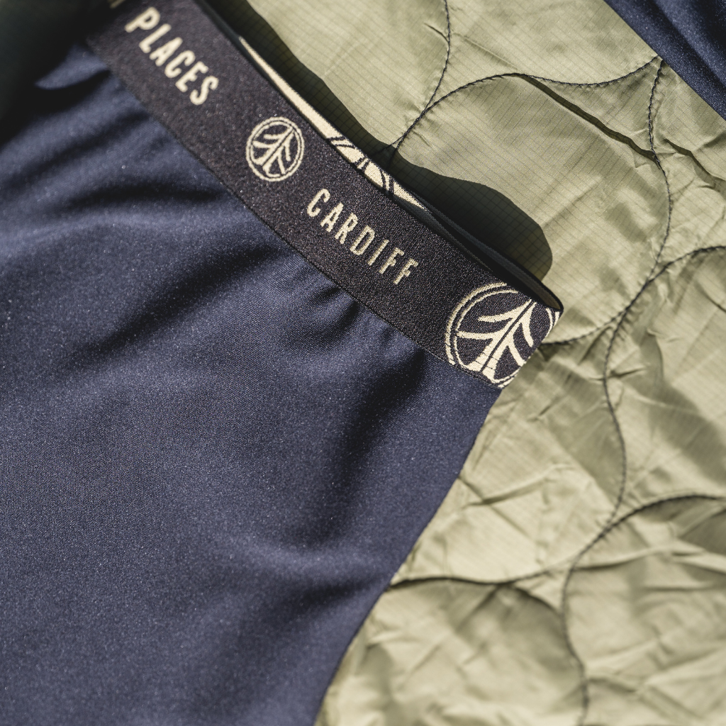 Cardiff x Corbeaux Centennial 3/4 Pant: Close-up of dark grey, durable fabric with subtle texture.